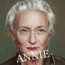 a close up of a woman 's face with gray hair and the name annie written on it .