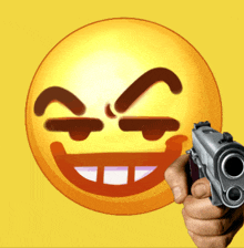 a hand is pointing a gun at a smiley face on a yellow background