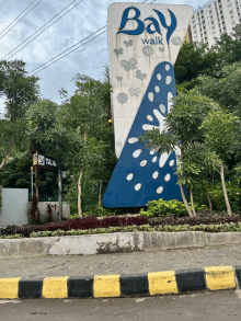 a blue and white sign that says bay walk on it