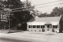 a black and white photo of a restaurant named the dwarf grill