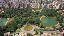 an aerial view of a park with a flower design in the middle of it