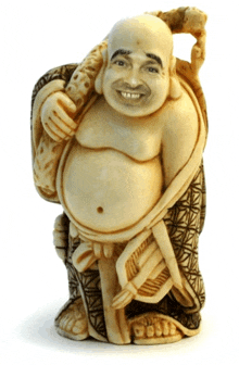 a statue of a laughing buddha with a man 's face drawn on it