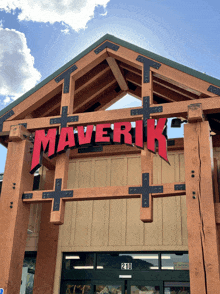 a store front with a red sign that says maverick