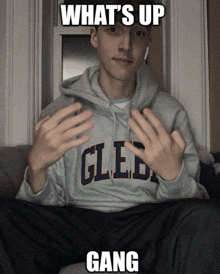 a man wearing a hoodie that says gled gang