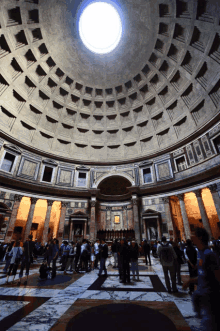 a dome in a building with a light coming out of the top