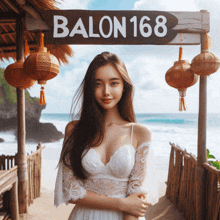 a woman in a white dress stands in front of a balon 168 sign