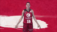 a woman wearing a casademont zaragoza basketball jersey