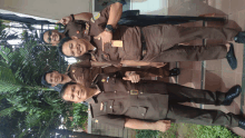 a group of men in military uniforms pose for a photo