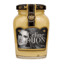 a jar of celine dijon mustard with a picture of a woman on the label