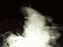 a black background with white smoke coming out of the bottom