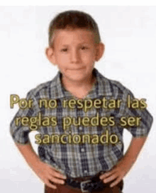 a young boy in a plaid shirt is standing with his hands on his hips and a quote in spanish .