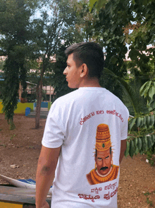 a man wearing a t-shirt with a picture of a man on it