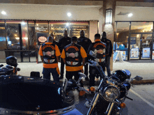 a group of motorcycle riders are standing in front of a building that says member 's lounge