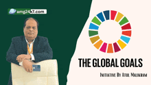 a man in a suit sits in a chair next to a sign that says the global goals