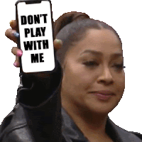 a woman is holding up a cell phone that says " don t play with me "