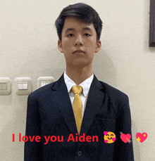 a young man in a suit and tie with the words i love you aiden