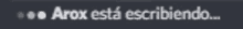 a blurry image of the word arox on a dark background