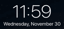 a phone screen displays the time of 12:00 on thursday december 1