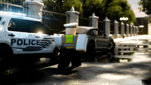 a police car is parked next to a car