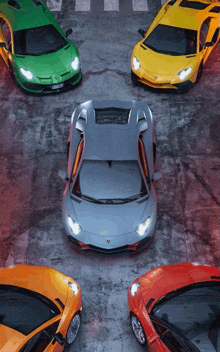 a group of lamborghini cars are parked in a row