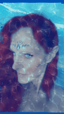 a painting of a woman with red hair and a blue background