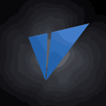 a blue triangle on a black background with a white outline