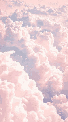 a bunch of pink clouds in the sky with a blue background