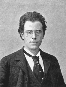 a black and white photo of a man wearing glasses