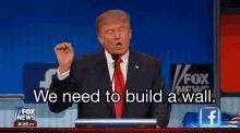 donald trump says we need to build a wall while giving a speech