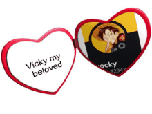 a heart shaped mirror that says vicky my beloved on it