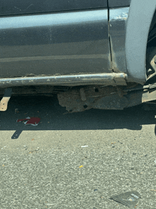 a canadian flag is on the ground next to a car