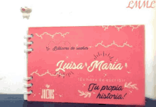 a book with the name luisa maria written on it