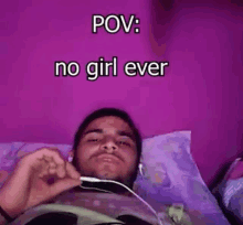 a man is laying on a bed with headphones on and the words `` pov : no girl ever '' above him .