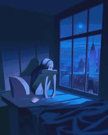 a girl is sitting in front of a window at night .