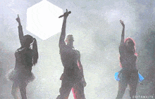 a group of people dancing in the rain with editsmaite in the corner