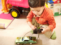 Toddler playing with a toy on floor