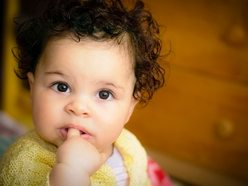 Baby with her finger in her mouth