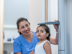 2 year old girl getting her height checked