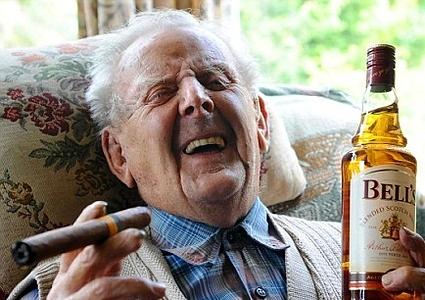 old man drinking and smoking 