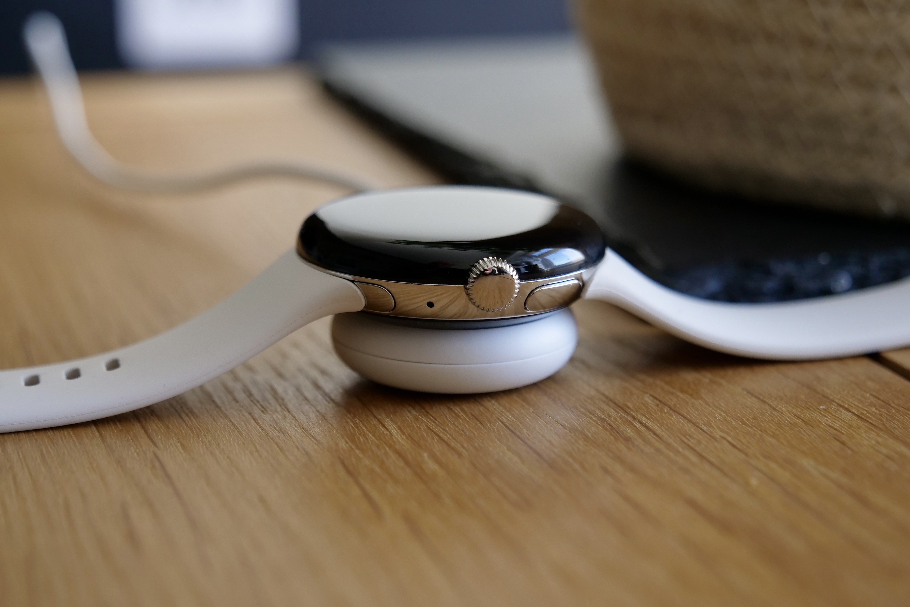 The Google Pixel Watch on its charging puck.