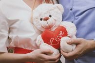 Couple Holding Love Bear