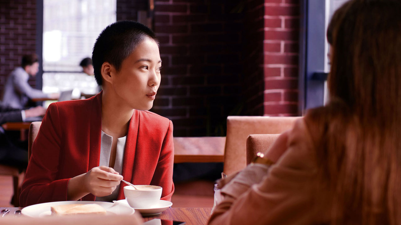 Young woman having coffee