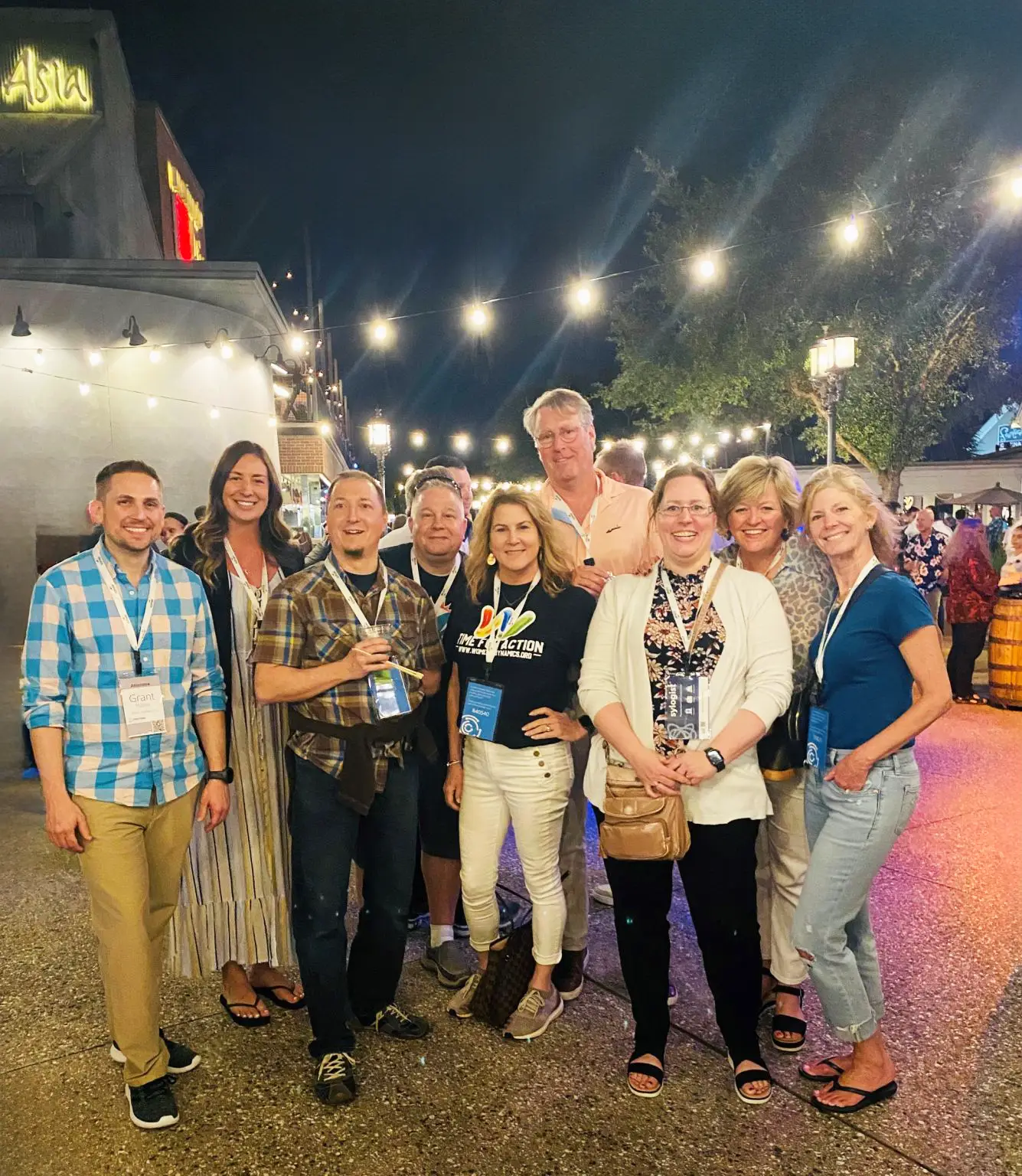 group of people standing together for a photo and smiling