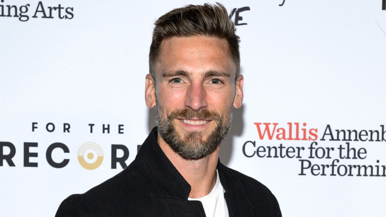 Andrew Walker smiles at an event