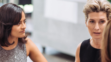 Three women talking in the office