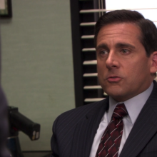 A man (Steve Carell as Michael Scott on "The Office") singing at his desk.