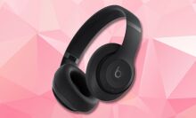 black beats studio pro headphones on a pink geometric background