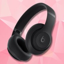 black beats studio pro headphones on a pink geometric background