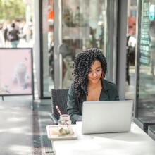 Girl using laptop at desk