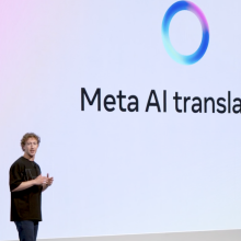 Mark Zuckerberg in front of a screen that says Meta AI translation